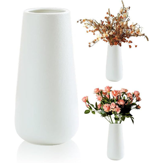 Set of three white vases with floral arrangements on a white background