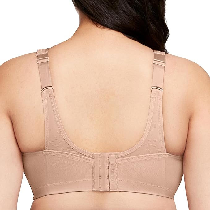 Beige bra worn by a person on a white background