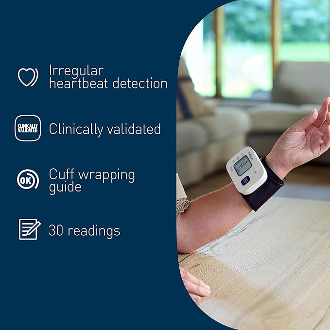 Person using a blood pressure monitor with product features listed on the left.