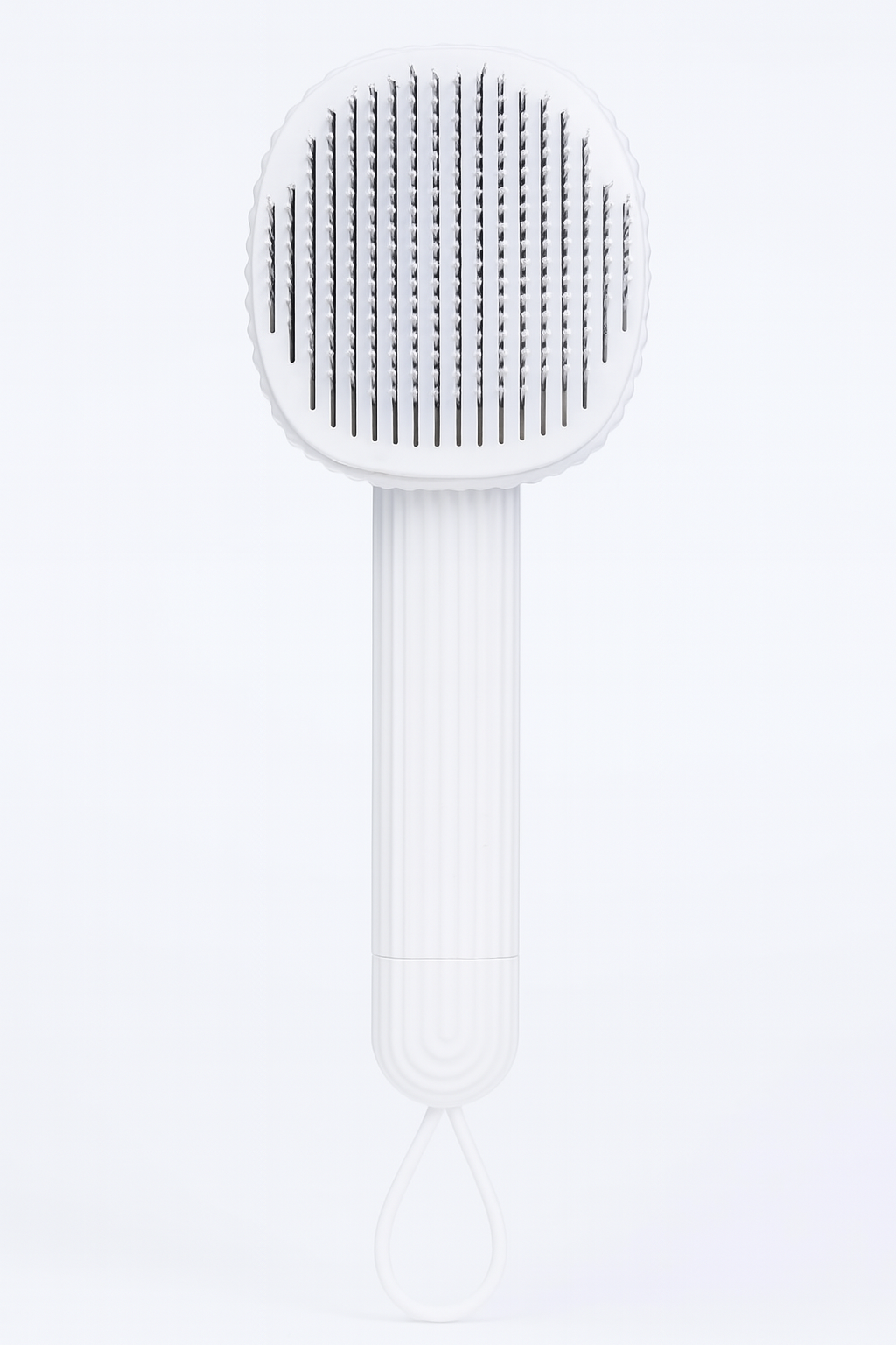 White pet brush with textured head on a white background
