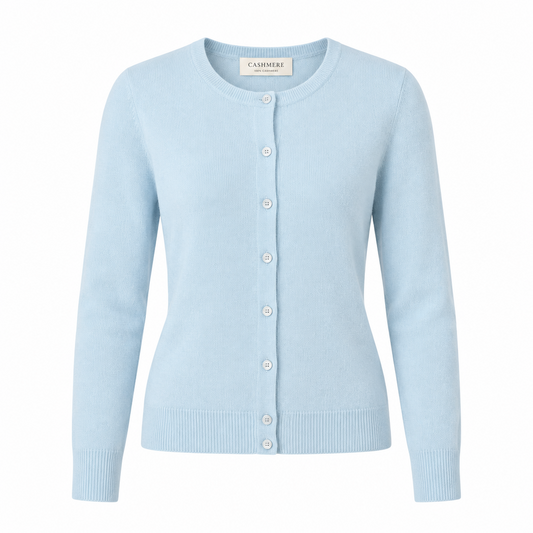 light blue cardigan sitting in a chair on a white background