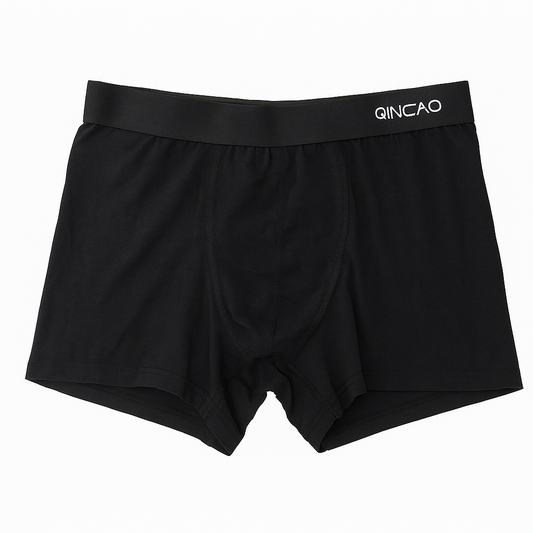 Black boxer briefs with a visible brand logo on a white background