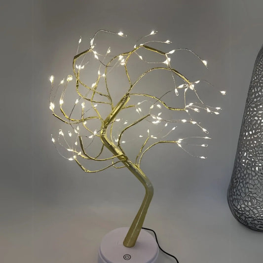 https://cdn.shopify.com/s/files/1/0633/6905/2238/files/Lampara-Decorativa-Bonsai-Dorado-Claro.webp?v=1740753760