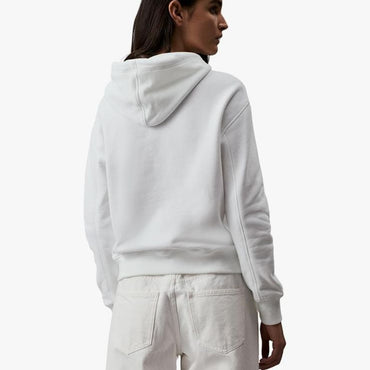 Calvin Klein white hoodie on a model with product details and store link.