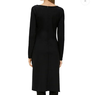 Black dress displayed on a mannequin with a white background