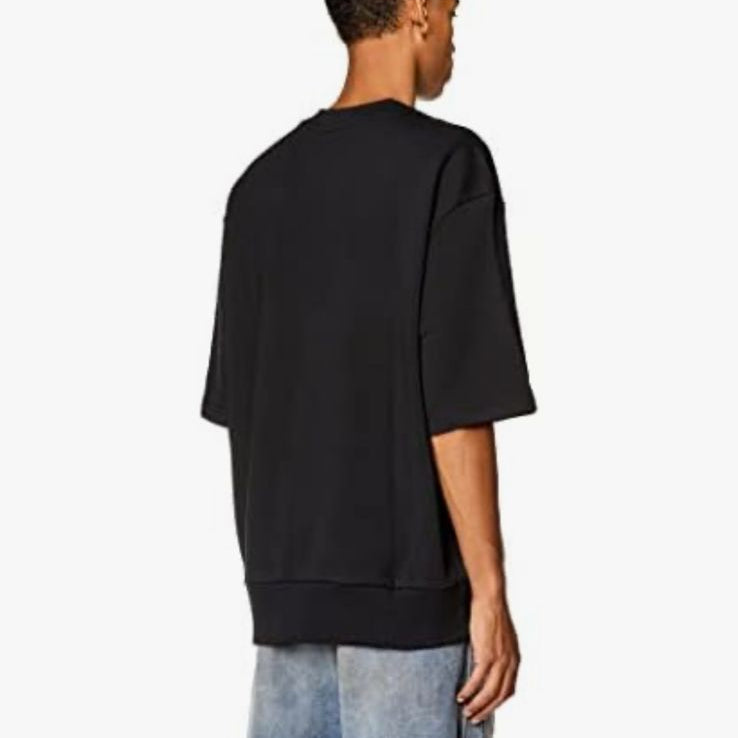 Person wearing a black t-shirt and blue jeans on a shopping app interface.