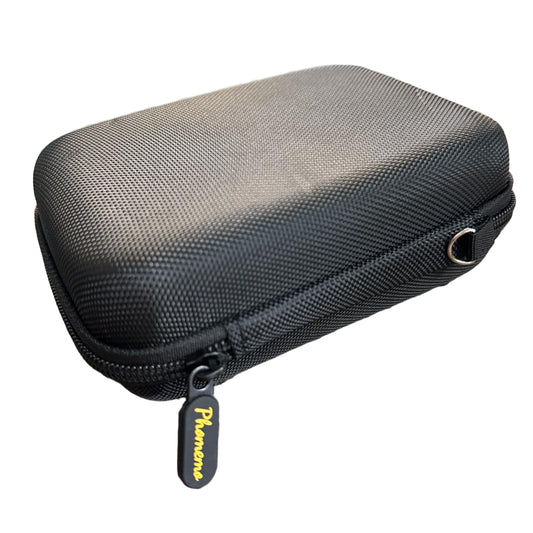 Black hard-shell carrying case with a zipper on a granite surface