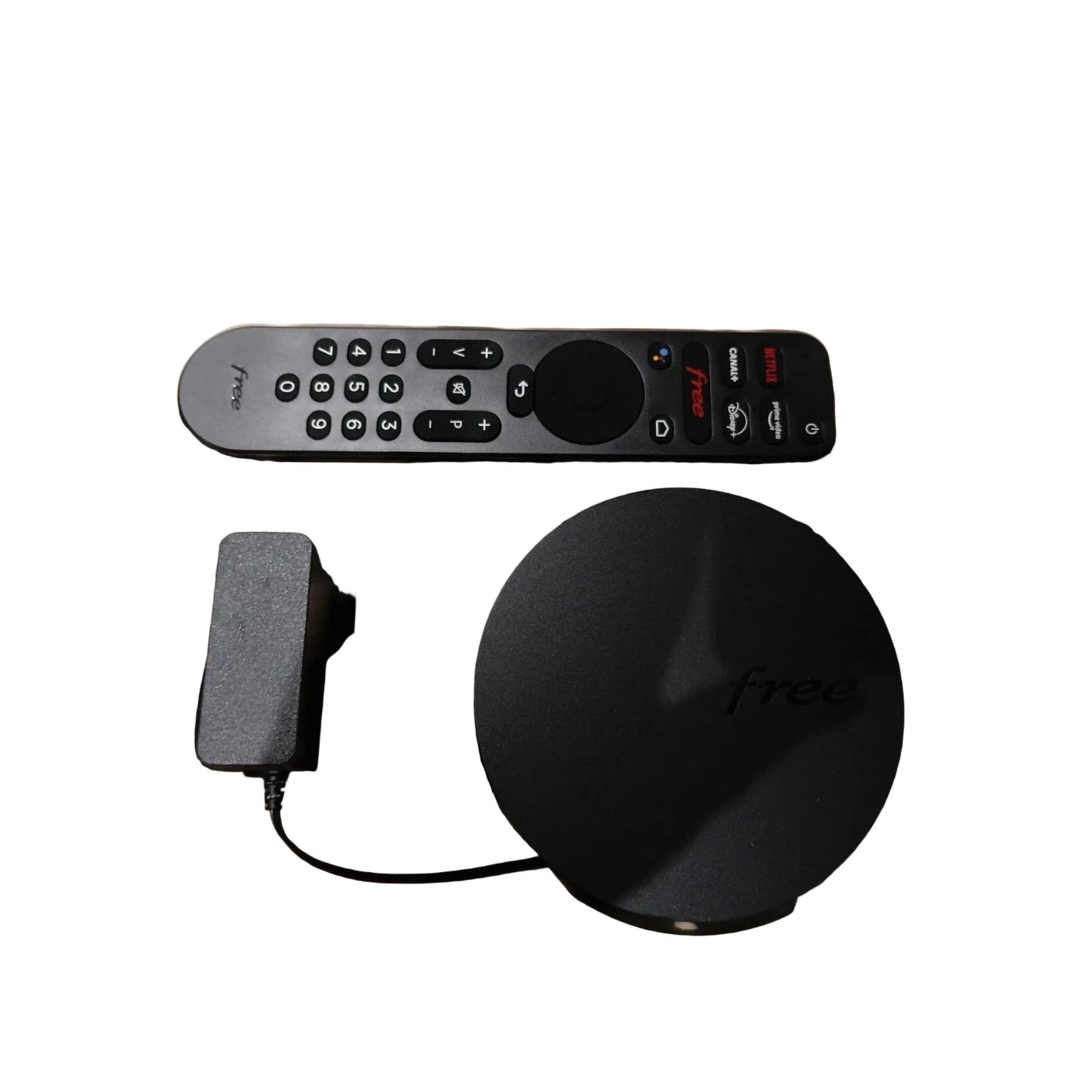 Freebox 4K TV set-top box featuring a compact black design with HDMI port, remote control, and support for Ultra HD streaming.