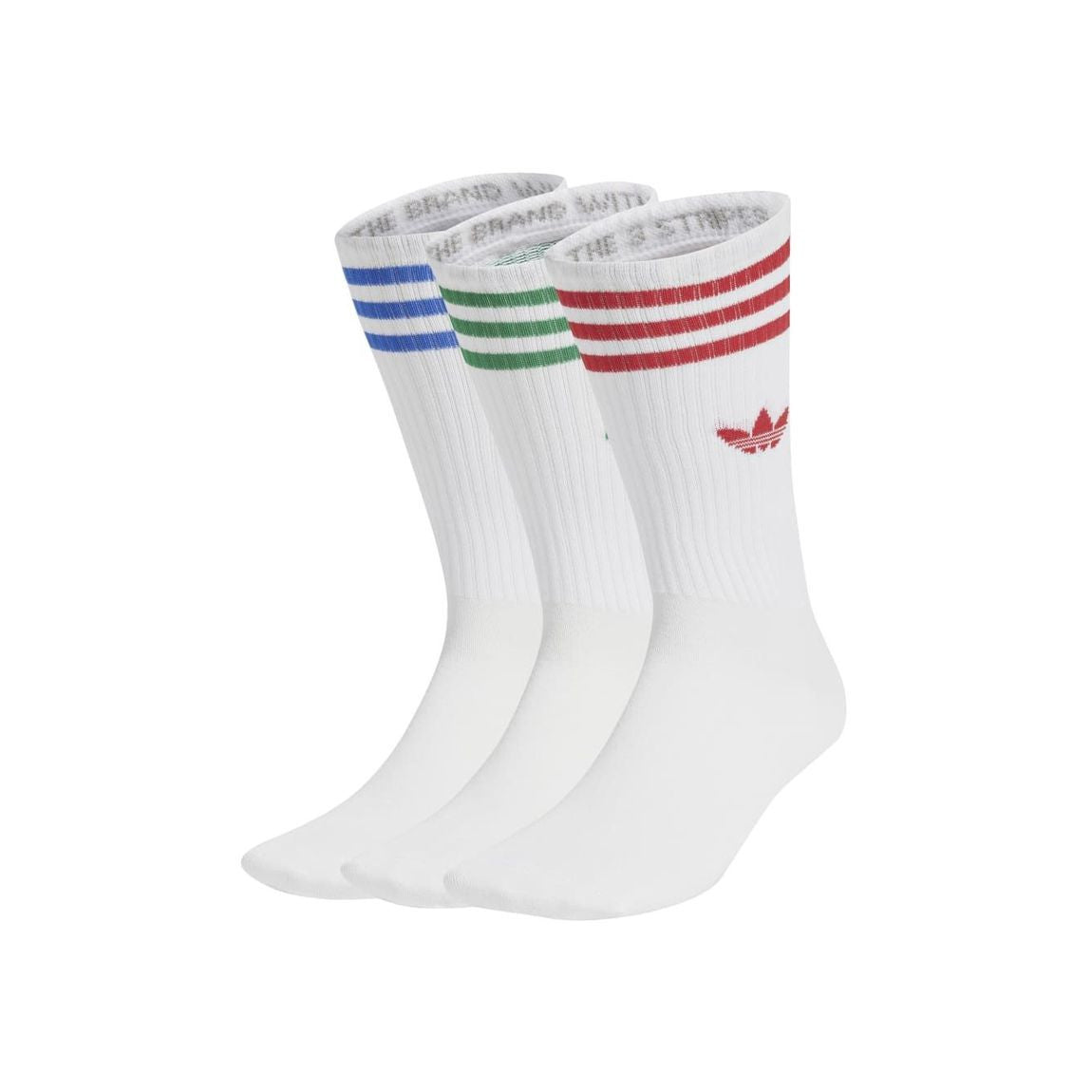 Three pairs of white socks with colored stripes on a white background