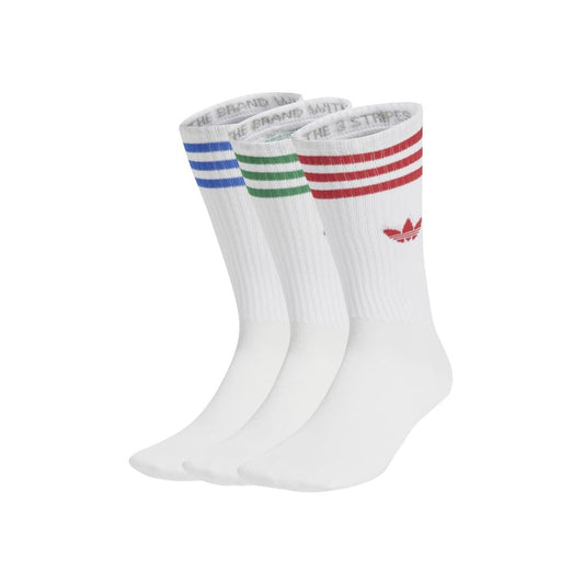 Three pairs of white socks with colored stripes on a white background