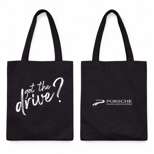 Black tote bag with 'got the drive?' text and Porsche logo on a white background