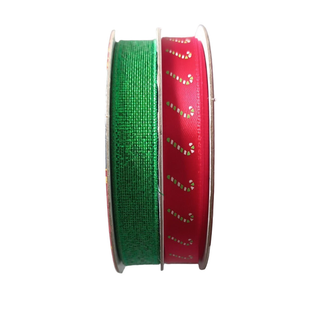 Two spools of ribbon, one green and one red with candy cane pattern, on a white background.