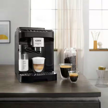 DELONGHI MAGNIFICA EVO Black coffee machine on a wooden table with two cups of coffee and a container of coffee beans.