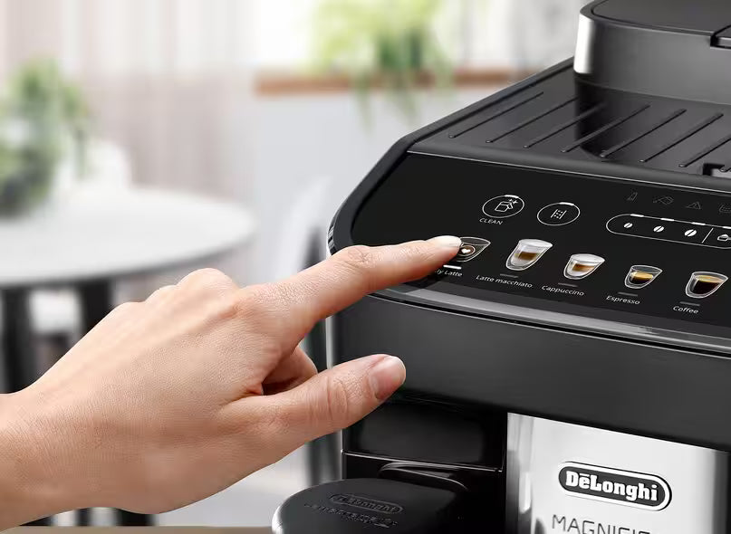 Person using a De'Longhi coffee machine with a blurred background