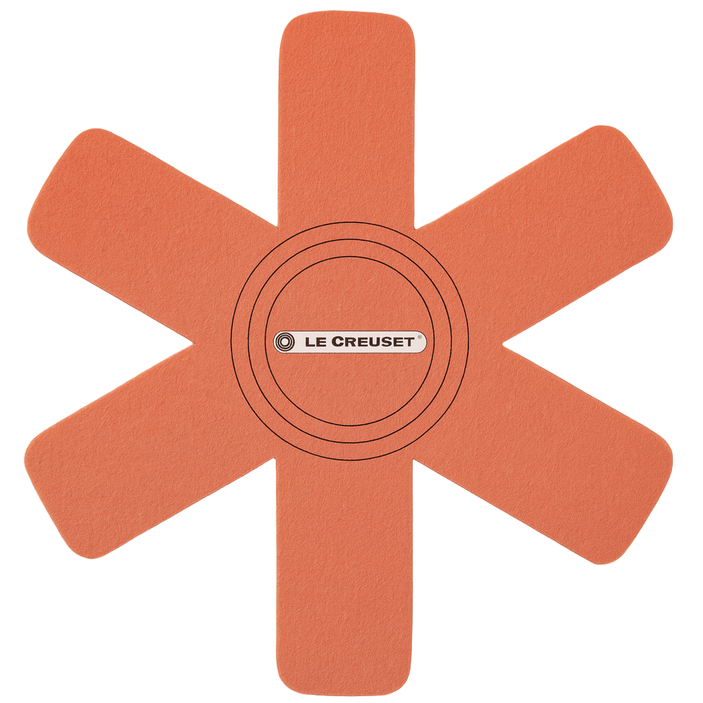 Orange silicone mat with 'Le Creuset' logo on a white background