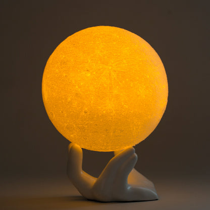 https://www.fnp.com/images/pr/x/v20210505164159/3d-printed-moon-in-the-palm-table-lamp_1.jpg