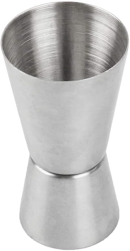 Stainless steel jigger on a white background