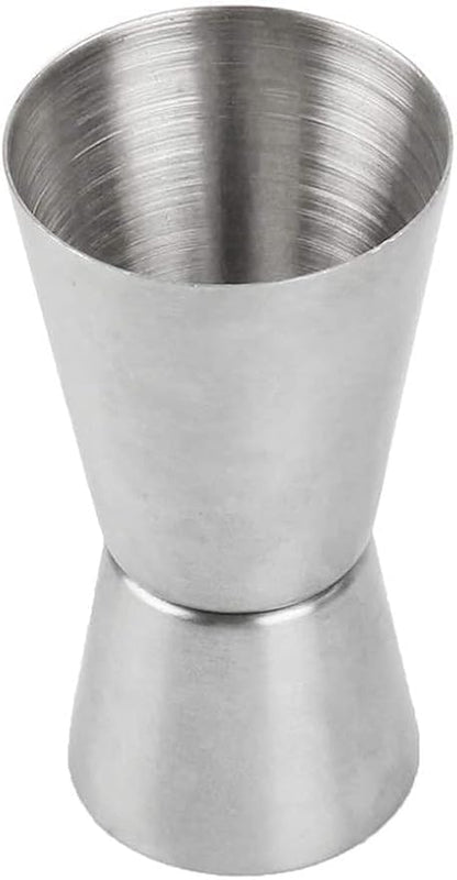 Stainless steel jigger on a white background