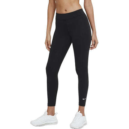 Person wearing black Nike leggings on a white background
