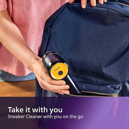 Person holding a sneaker cleaner with a navy blue bag in the background