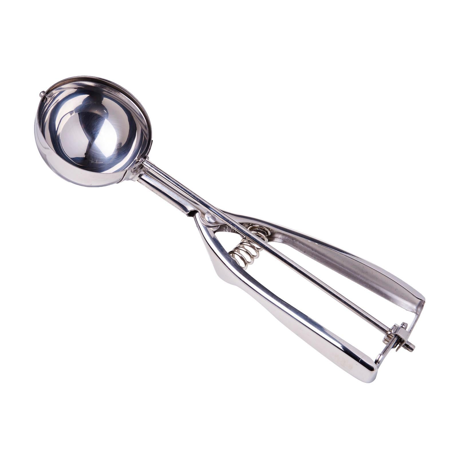 Metallic ice cream scoop on a white background