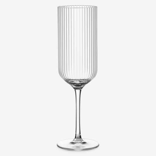 Clear glass wine glass with vertical ribbing on a white background