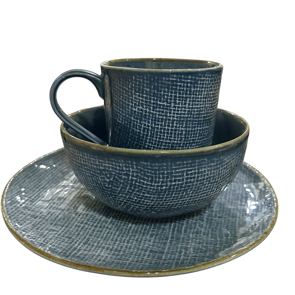 Set of blue ceramic tableware including a cup, bowl, and saucer on a white background
