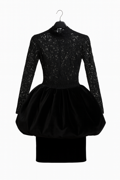 Black dress with long sleeves and a puffy skirt on a hanger against a white background