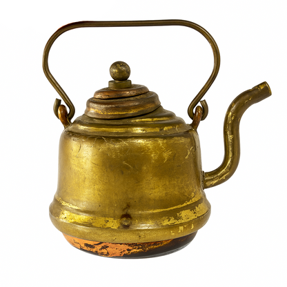 Small brass teapot on a white background