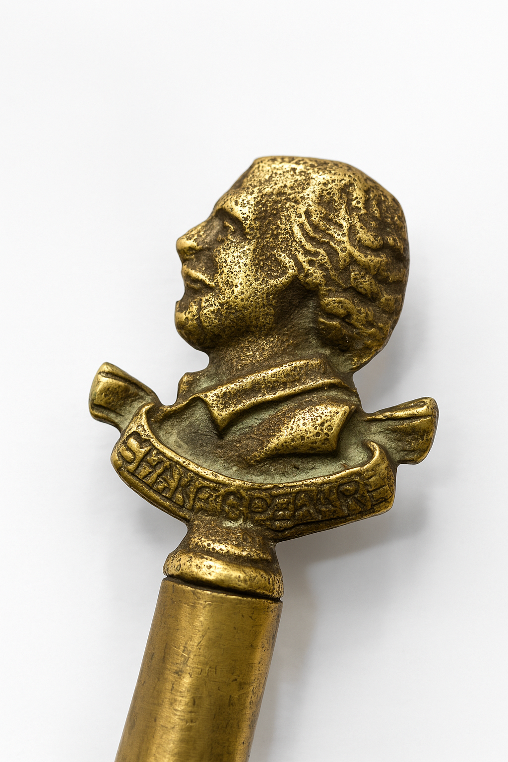 Bronze object with a bust of a person on a white background