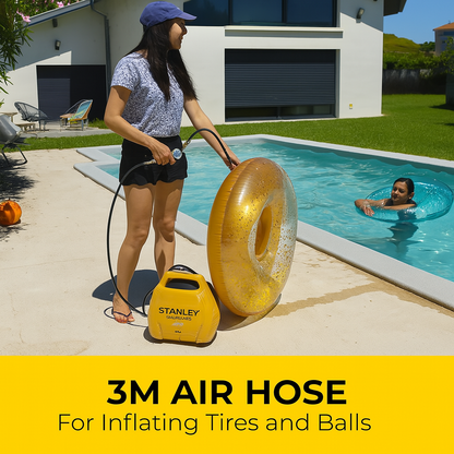 Person inflating a gold inner tube with a Stanley air compressor by a pool.