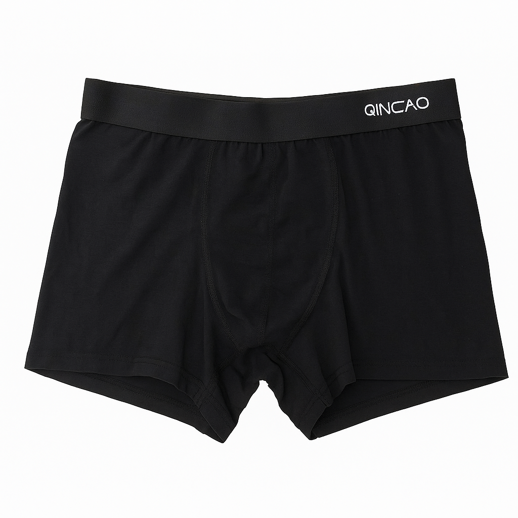 Black boxer briefs with a visible brand logo on a white background