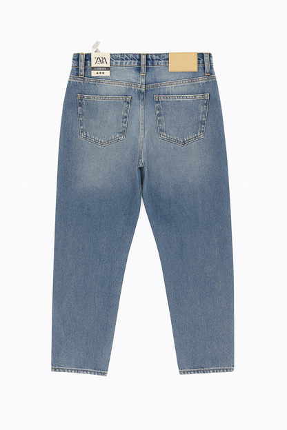 Blue jeans with a brand label on a white background