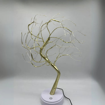 https://cdn.shopify.com/s/files/1/0633/6905/2238/files/Lampara-Decorativa-Bonsai-Dorado-Claro-en-Guayaquil.webp?v=1740753760