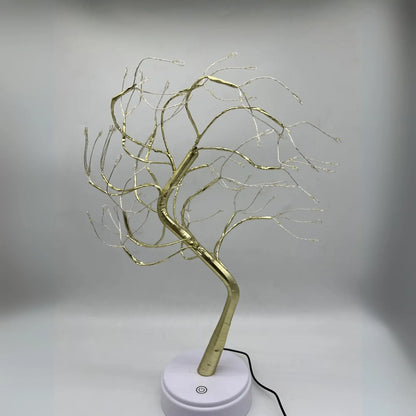 https://cdn.shopify.com/s/files/1/0633/6905/2238/files/Lampara-Decorativa-Bonsai-Dorado-Claro-en-Guayaquil.webp?v=1740753760