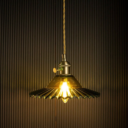 https://www.whisperinghomes.com/media/catalog/product/cache/50170b61c97e2e4a313bb0d8bb8e0986/Pendant-Lights/LA-HL-07-157/Ribbed-Floral-Glass-Pendant-Light-Green-On-Black-Background.jpg