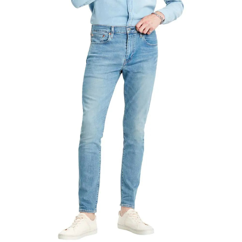 Levis Light blue jeans worn by a person on a white background