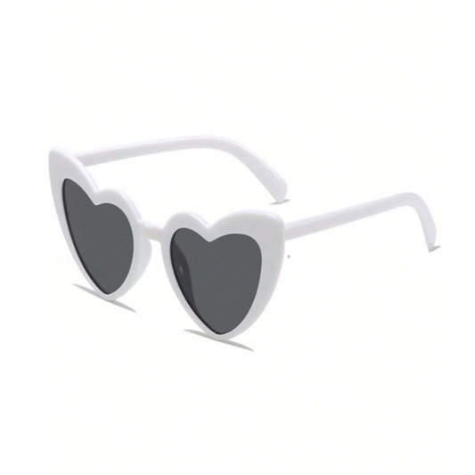 Heart-shaped sunglasses with white frame and dark lenses on a white background