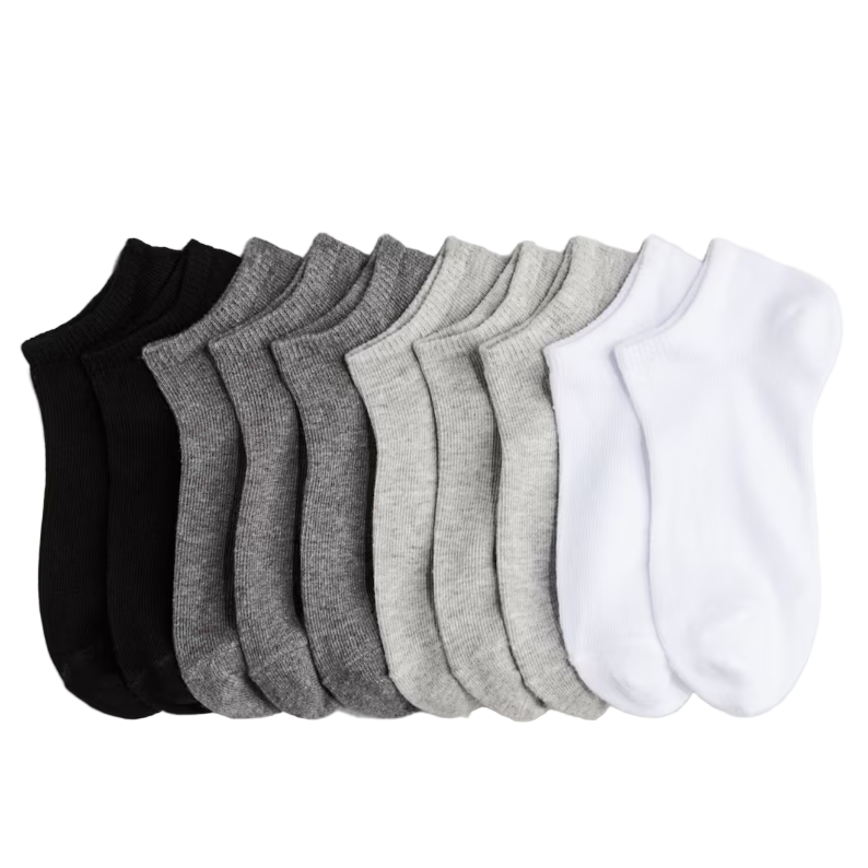 Set of black, gray, and white socks on a light gray background with H&M logo.