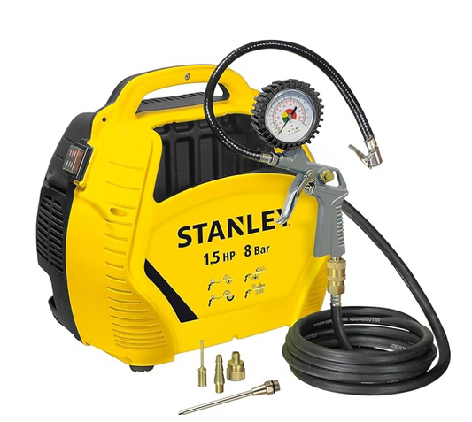 Yellow and black Stanley air compressor with hose and attachments on a white background