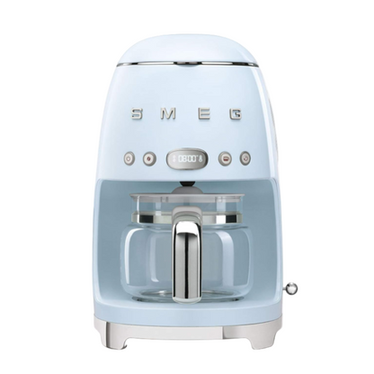 Light blue coffee machine with SMEG branding on a white background