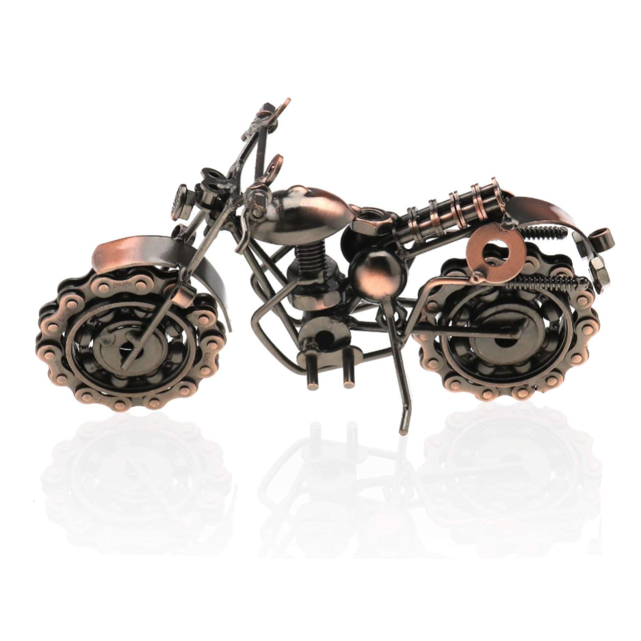 Metallic motorcycle sculpture on a white background