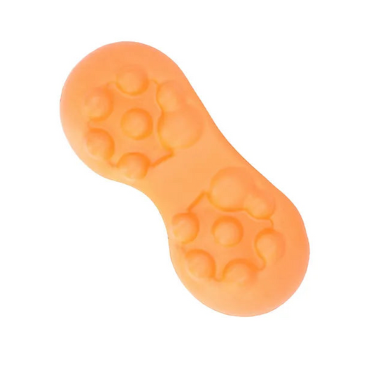 Orange slipper with textured sole on a white background