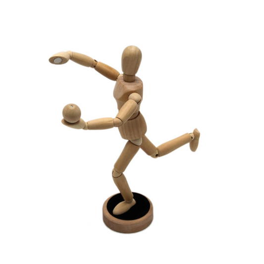 Wooden mannequin figure on a white background