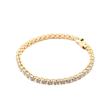 Gold bracelet with crystals on a white background