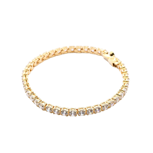 Gold bracelet with crystals on a white background