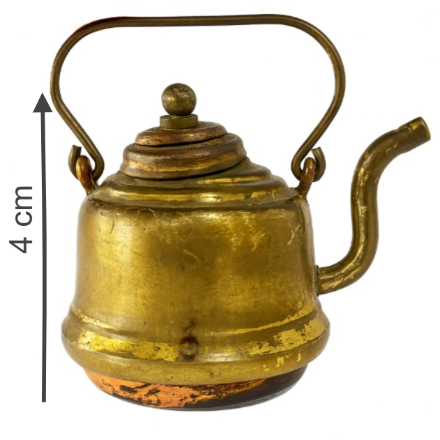 Brass kettle with measurement indicator on a white background