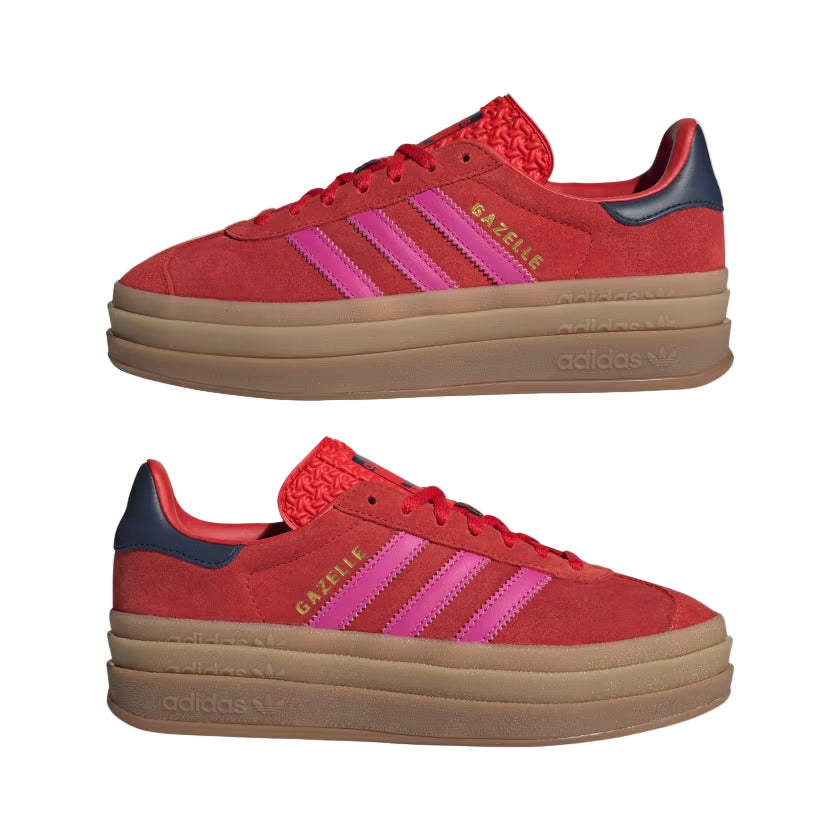 Red Adidas sneakers with pink stripes on a light gray background