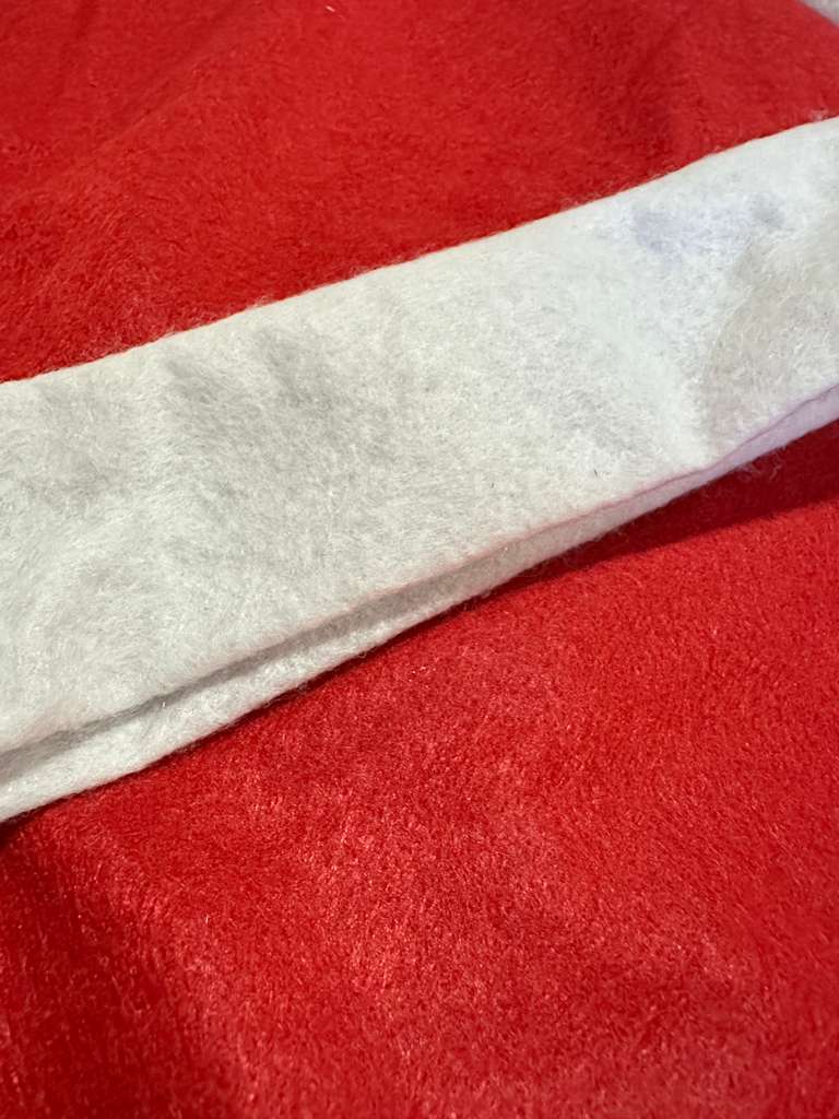 Close-up of red fabric with a white stripe