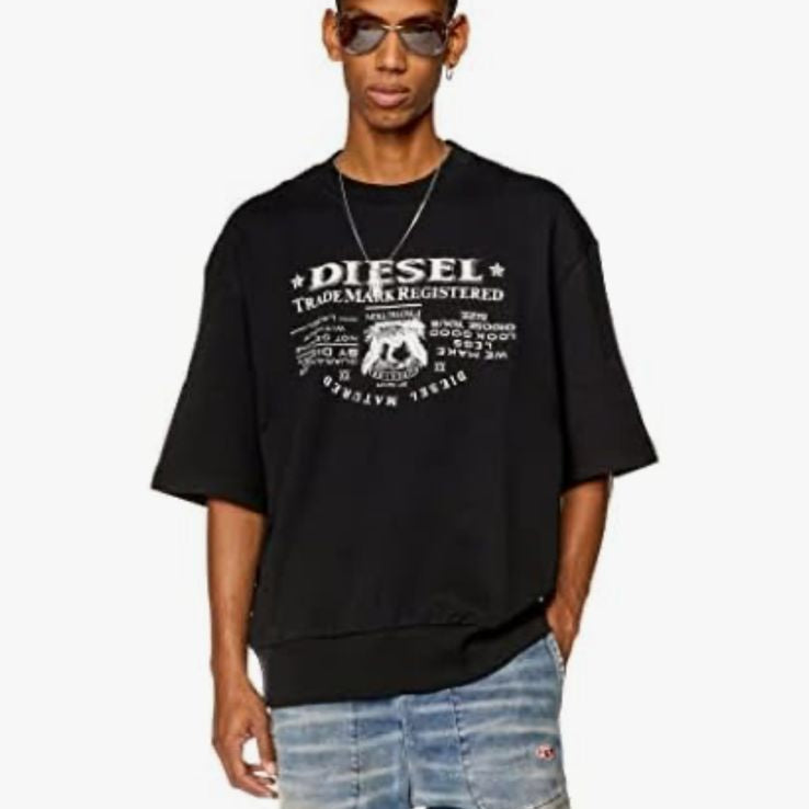 Man wearing a black Diesel t-shirt with text and graphics on a smartphone screen.